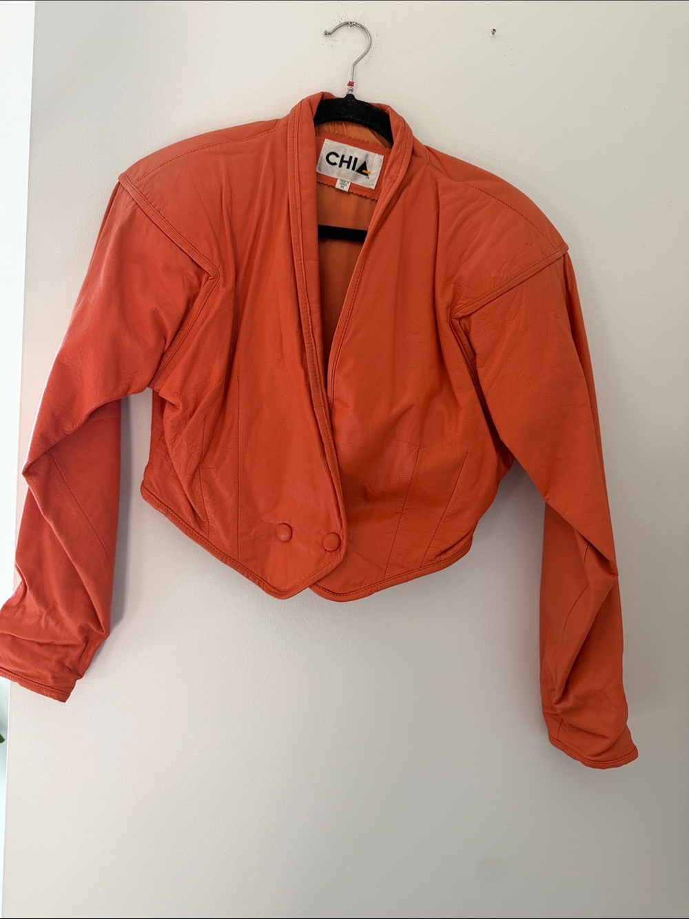 CHIA Orange Cropped Leather Jacket — V-Neck Button-Tab Style
